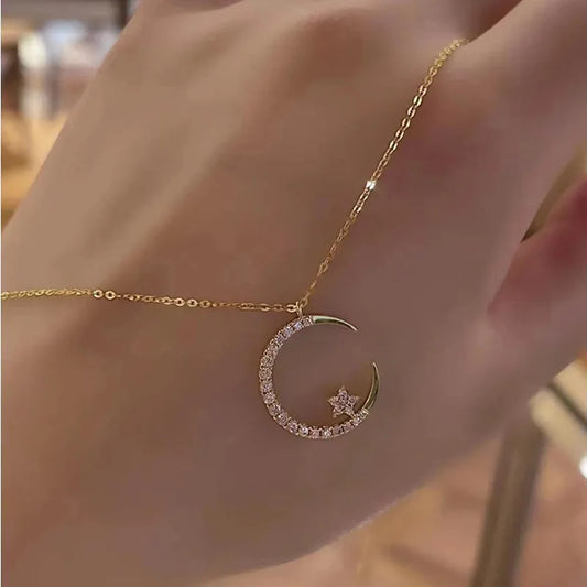 ✨ Add celestial charm to your look with the Crystal Shining Inlaid Zirconia Moon Star Pendant Necklace by Glam Sleek. Featuring a sparkling moon and star design with shimmering zirconia crystals, this dainty gold-tone necklace is perfect for everyday wear or special occasions. Lightweight, elegant, and versatile, it makes an ideal gift for women who love trendy, minimalist jewelry. Shop Glam Sleek for affordable fashion necklaces that blend modern style with timeless elegance.