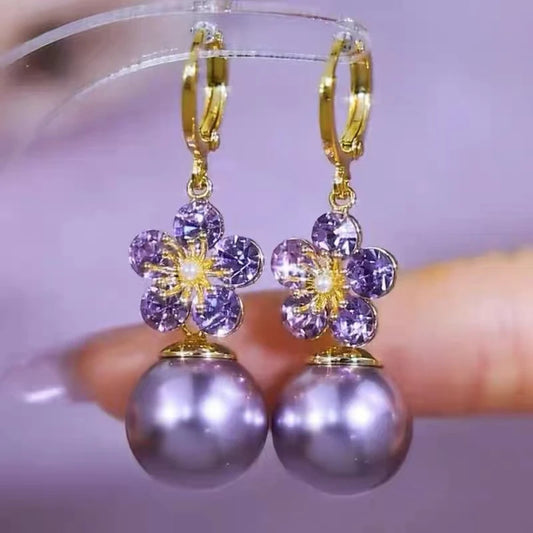✨ Exquisite Purple Crystal Flower Dangle Earrings by Glam Sleek ✨
Add a touch of elegance with these purple crystal flower dangle earrings, crafted with a shimmering floral design in a chic gold-tone finish. Perfect as statement earrings for weddings, parties, or everyday glamour, they blend trendy fashion jewelry with timeless sophistication. Lightweight, durable, and eye-catching, these crystal drop earrings are a must-have accessory for women who love stylish and unique jewelry.