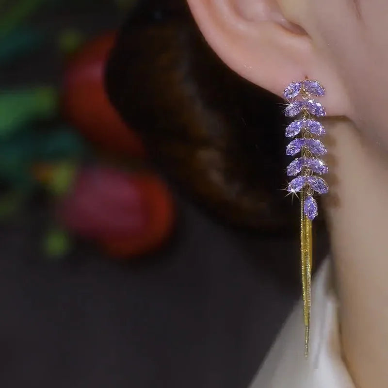 Elevate your elegance with the **Sparkling Purple Zircon Inlaid Wheat Ear Wire Long Tassel Earrings** by *Glam Sleek*. Featuring shimmering purple zircon stones inlaid in a delicate wheat ear design, these earrings exude timeless sophistication. The graceful long tassels add a touch of modern glamour, perfect for both formal occasions and stylish evenings out. Lightweight and versatile, they effortlessly enhance your look with a blend of luxury and charm.