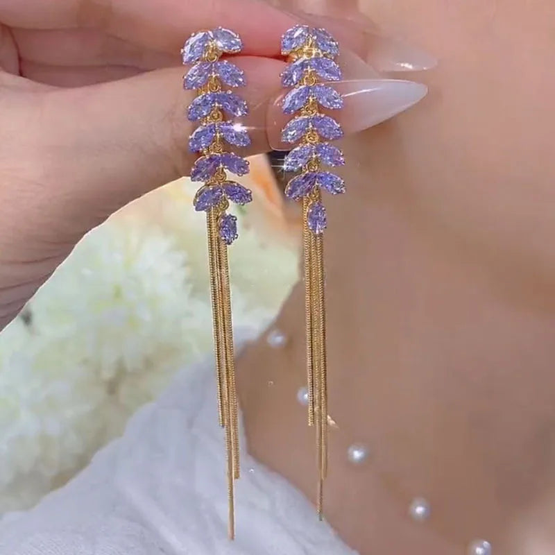 Elevate your elegance with the **Sparkling Purple Zircon Inlaid Wheat Ear Wire Long Tassel Earrings** by *Glam Sleek*. Featuring shimmering purple zircon stones inlaid in a delicate wheat ear design, these earrings exude timeless sophistication. The graceful long tassels add a touch of modern glamour, perfect for both formal occasions and stylish evenings out. Lightweight and versatile, they effortlessly enhance your look with a blend of luxury and charm.