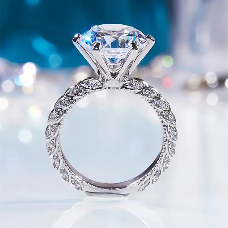 💍 5ct Grey White Moissanite Engagement Ring by Glam Sleek – A stunning blend of luxury and brilliance, crafted with a sparkling 5-carat moissanite center stone that rivals diamonds in fire and clarity. Featuring a unique grey-white moissanite hue, this elegant ring is set in a premium finish, making it the perfect choice for a modern engagement ring, promise ring, or anniversary gift. Designed for timeless beauty and durability, it captures sophistication and romance in every detail. Shop Glam Sleek’s mois