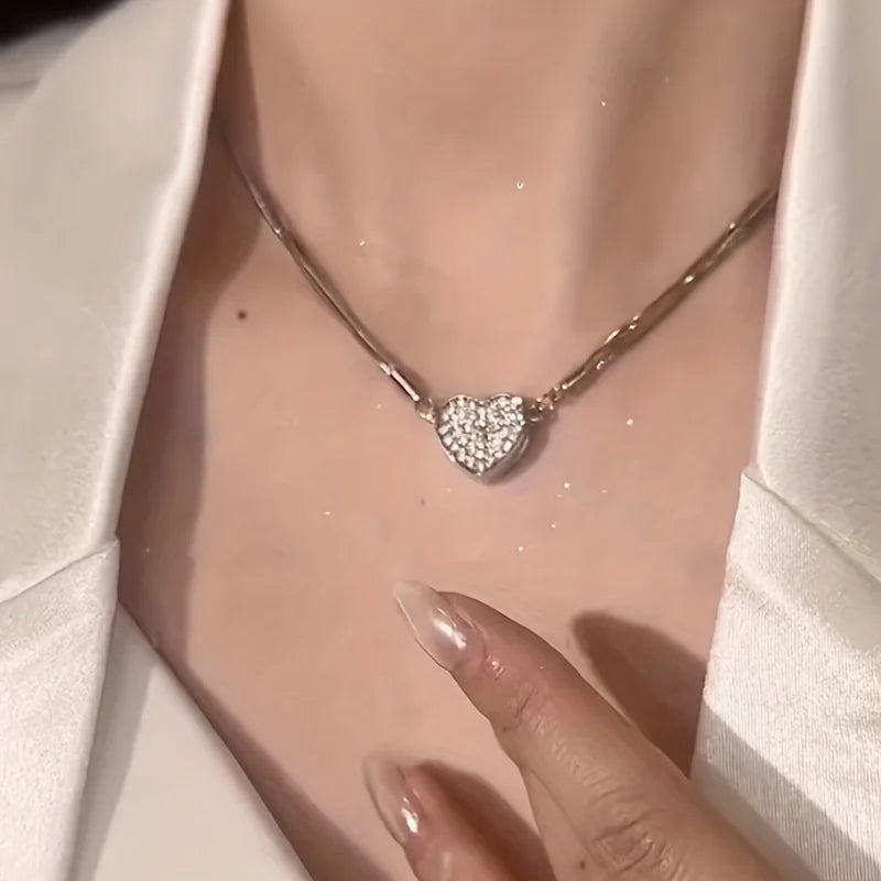 The *Elegant Heart Shaped Zircon Pendant* by Glam Sleek is the perfect blend of sophistication and charm. This exquisite pendant features a radiant zircon heart framed in a sleek, polished setting, capturing light beautifully to create a dazzling sparkle. Ideal for both everyday wear and special occasions, its timeless design complements any style, adding a touch of elegance and romance. A thoughtful gift choice that speaks to the heart, this pendant is crafted for those who appreciate refined simplicity an