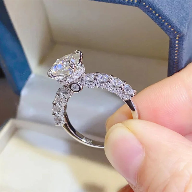 Introducing the **Glam Sleek Sparkling Moissanite Promise Ring**—a timeless symbol of love and commitment. Crafted with a brilliant moissanite gemstone, it dazzles with unmatched sparkle, resembling the beauty of a diamond at a fraction of the cost. Set in sleek, polished metal, this ring combines elegance and sophistication, perfect for celebrating your most cherished promises.