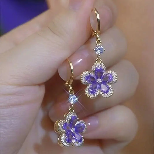 ✨ Fashionable Purple Crystal Zircon Flower Drop Earrings by Glam Sleek ✨
Add sparkle to your style with these purple crystal zircon flower drop earrings, designed for elegance and everyday glamour. Featuring a gold-tone finish with dazzling zircon stones, these lightweight statement earrings are perfect for parties, weddings, or casual wear. A must-have fashion jewelry piece for women who love timeless yet trendy accessories.