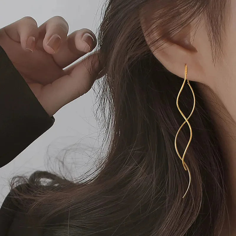 Shop minimalist long wavy fringe earrings for women at Glam Sleek. Elegant hanging earrings perfect for everyday, party, wedding and formal looks.