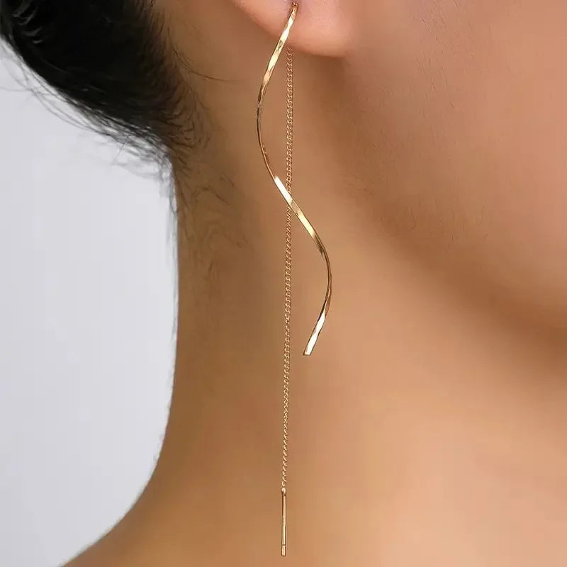 Elevate your look with these minimalist long fringe earrings, designed with elegant wavy lines and a lightweight hanging style. Perfect for adding a modern, sophisticated touch to everyday outfits, parties, weddings, and special occasions. A versatile choice for women who love trendy statement earrings with a minimalist finish.