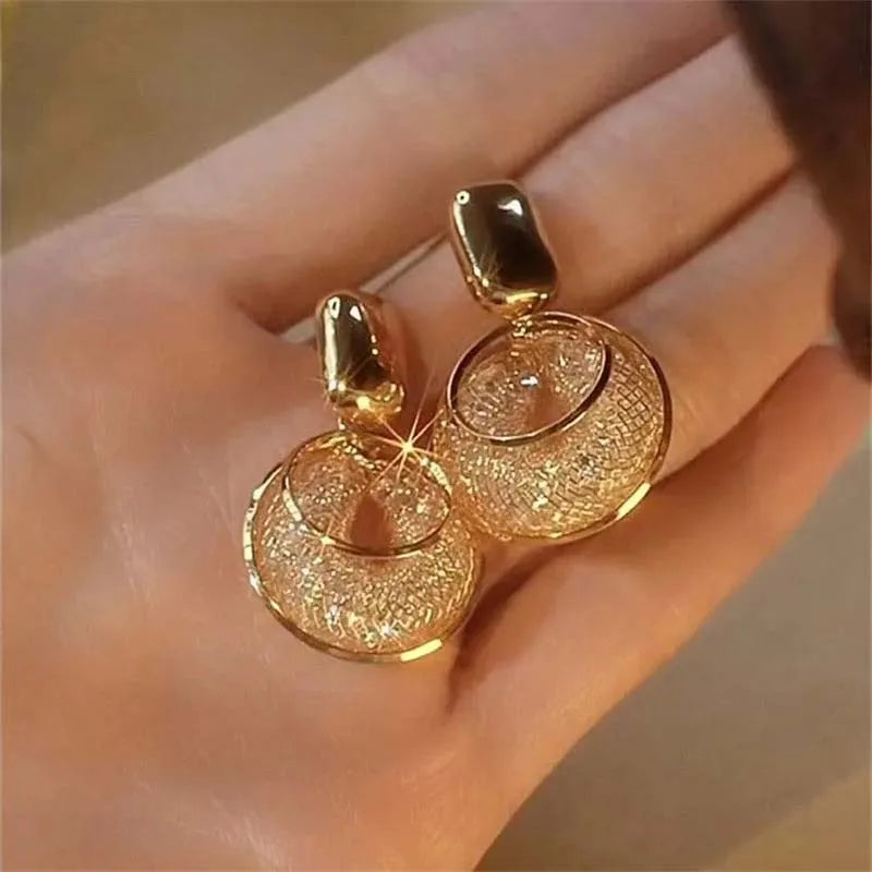 Shop Glam Sleek vintage round dangle earrings for women. Bold statement jewelry with an elegant design, perfect for parties, weddings and everyday style.