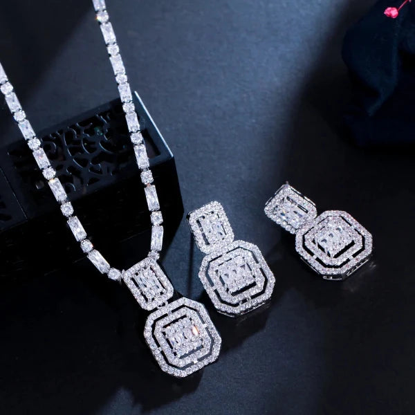 Luxury Water Shiny Baguette Cubic Zirconia Wedding Bridal Party Necklace Set for Women by Glam Sleek features dazzling baguette-cut cubic zirconia stones designed to create an elegant, luxurious sparkle. Perfect for weddings, bridal parties, engagements, parties, and special occasions, this statement jewelry set adds sophisticated glamour to any outfit.