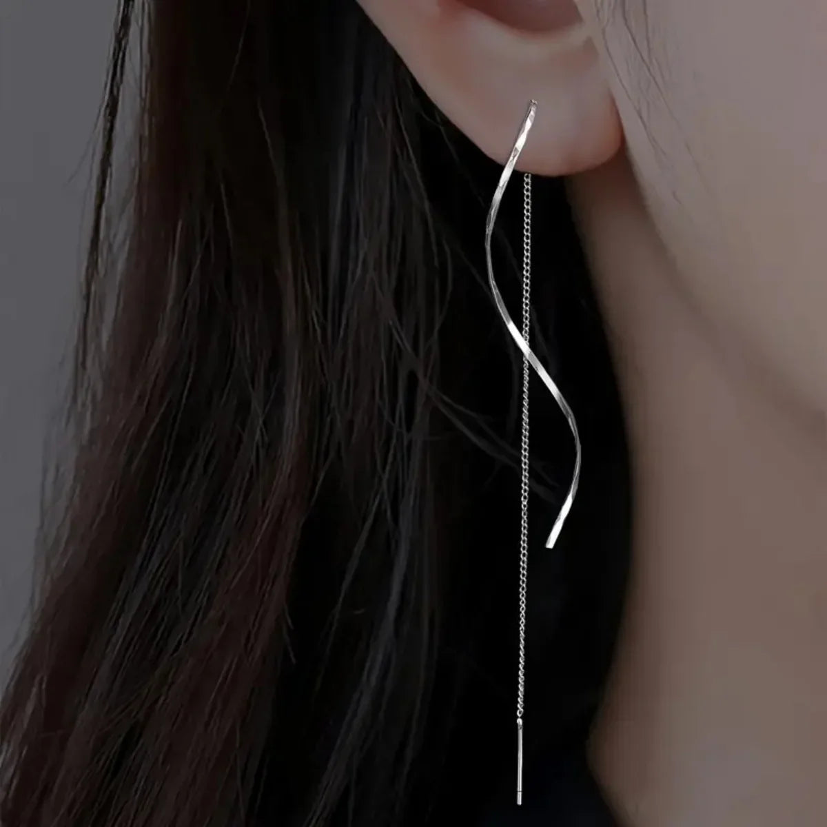 Elevate your look with these minimalist long fringe earrings, designed with elegant wavy lines and a lightweight hanging style. Perfect for adding a modern, sophisticated touch to everyday outfits, parties, weddings, and special occasions. A versatile choice for women who love trendy statement earrings with a minimalist finish.