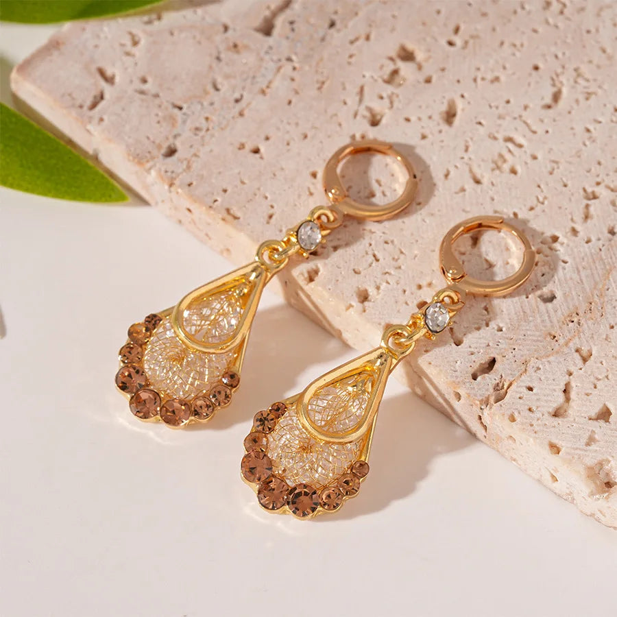 ✨ Add a touch of glamour with Glam Sleek Elegant Sparkling Coffee Water Drop Crystal Long Tassel Earrings. Designed with shimmering crystals in a chic coffee-tone water drop style, these long tassel dangle earrings bring elegance, sparkle, and sophistication to any outfit. Perfect for parties, weddings, evening wear, or special occasions, they make a stunning statement while remaining lightweight and comfortable. Elevate your jewelry collection with these fashion-forward crystal earrings loved for their lux