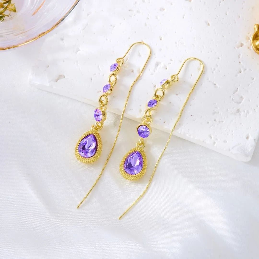 Shine with elegance in Glam Sleek’s Elegant Purple Crystal Waterdrop Long Tassel Ear Line Earrings. Featuring sparkling purple crystals and a delicate tassel ear line design, these lightweight statement earrings add sophistication to evening wear, parties, and special occasions. Perfect for women who love trendy, stylish, and modern jewelry, these waterdrop dangle earrings combine glamour with comfort for a timeless fashion accessory.
