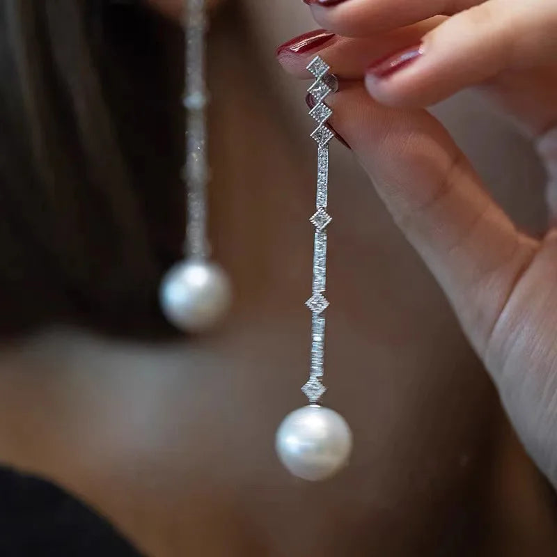 Shop elegant pearl long drop earrings for women at Glam Sleek. Perfect for weddings, parties, formal occasions, and everyday elegant style.
