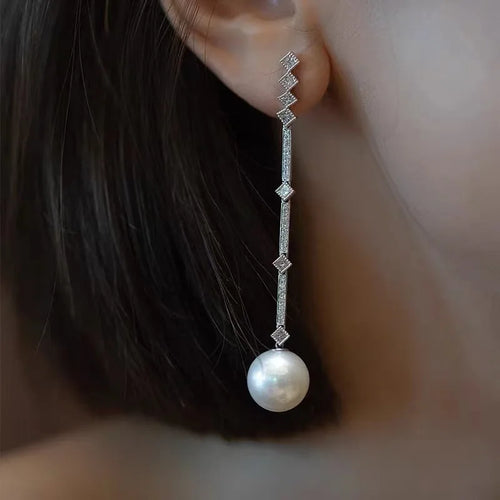 Shop elegant pearl long drop earrings for women at Glam Sleek. Perfect for weddings, parties, formal occasions, and everyday elegant style.