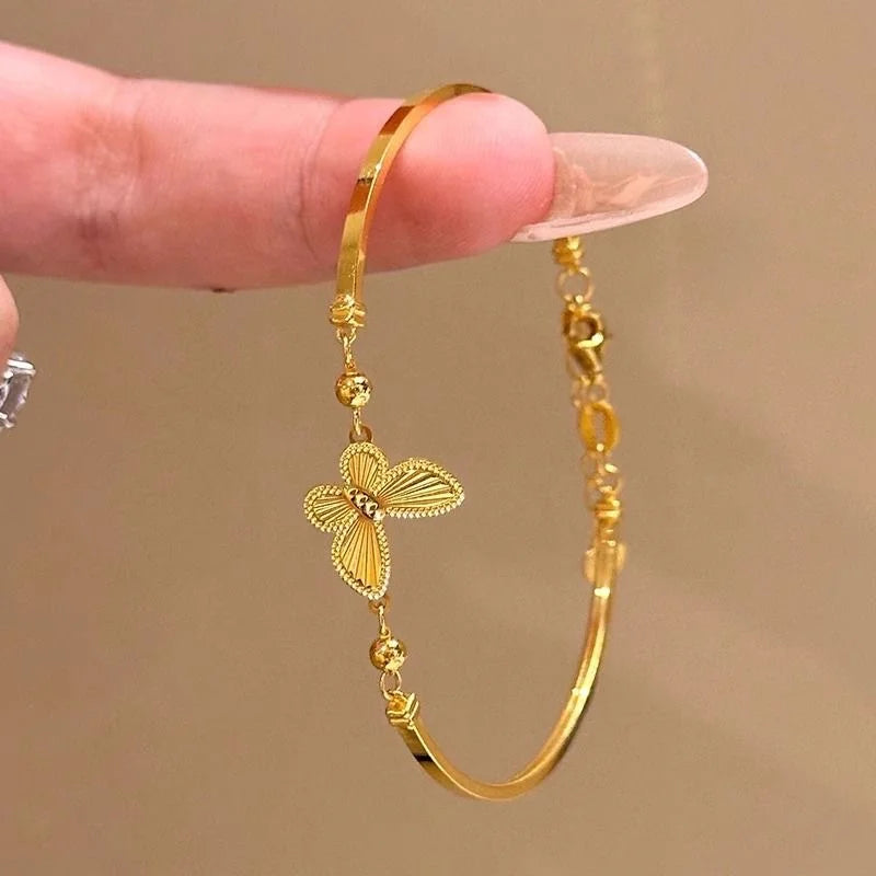 Light Luxury Shiny Zircon Golden Butterfly Bracelet for Women — an elegant gold-tone bracelet featuring sparkling zircon accents and a delicate butterfly design. Lightweight and stylish, it adds a refined touch to everyday outfits, parties, weddings, and special occasions. A beautiful choice for women who love trendy, elegant and feminine jewelry.