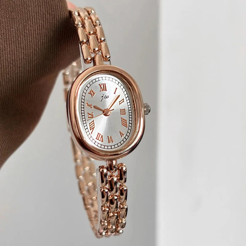 Shop Glam Sleek’s versatile oval quartz watch for women. A fashionable rose wristwatch with an elegant design, perfect for everyday wear, parties and special occasions.