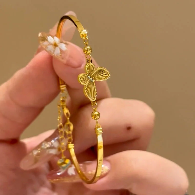 Light Luxury Shiny Zircon Golden Butterfly Bracelet for Women — an elegant gold-tone bracelet featuring sparkling zircon accents and a delicate butterfly design. Lightweight and stylish, it adds a refined touch to everyday outfits, parties, weddings, and special occasions. A beautiful choice for women who love trendy, elegant and feminine jewelry.