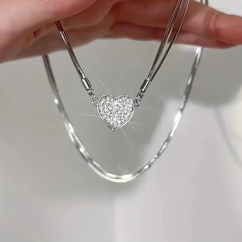 The *Elegant Heart Shaped Zircon Pendant* by Glam Sleek is the perfect blend of sophistication and charm. This exquisite pendant features a radiant zircon heart framed in a sleek, polished setting, capturing light beautifully to create a dazzling sparkle. Ideal for both everyday wear and special occasions, its timeless design complements any style, adding a touch of elegance and romance. A thoughtful gift choice that speaks to the heart, this pendant is crafted for those who appreciate refined simplicity an