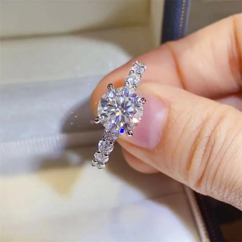 Introducing the **Glam Sleek Sparkling Moissanite Promise Ring**—a timeless symbol of love and commitment. Crafted with a brilliant moissanite gemstone, it dazzles with unmatched sparkle, resembling the beauty of a diamond at a fraction of the cost. Set in sleek, polished metal, this ring combines elegance and sophistication, perfect for celebrating your most cherished promises.