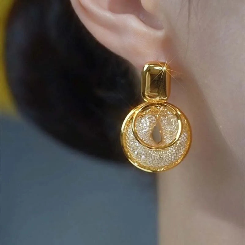 Shop Glam Sleek vintage round dangle earrings for women. Bold statement jewelry with an elegant design, perfect for parties, weddings and everyday style.