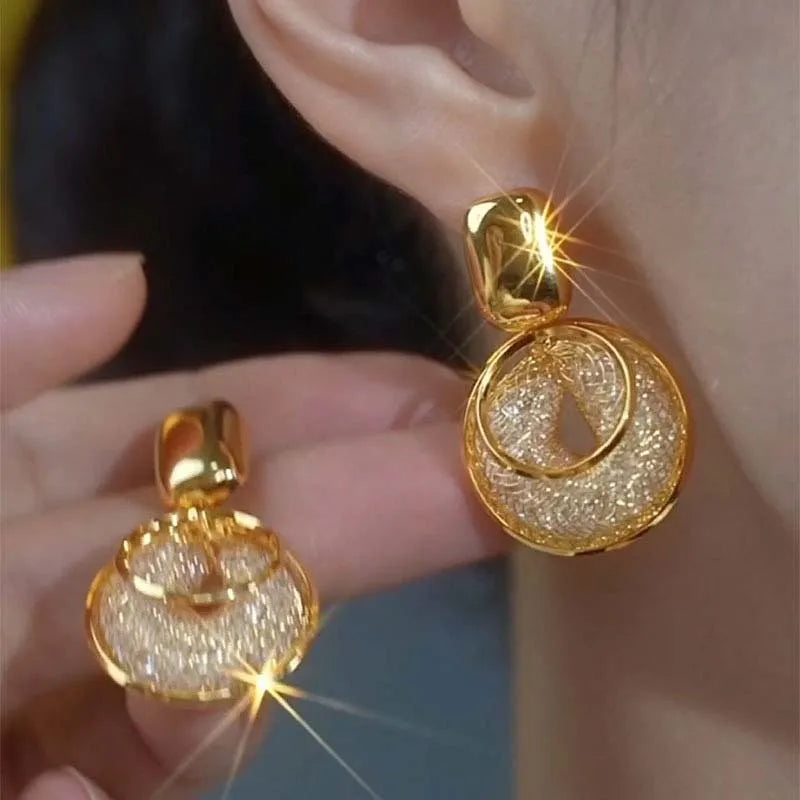 Shop Glam Sleek vintage round dangle earrings for women. Bold statement jewelry with an elegant design, perfect for parties, weddings and everyday style.