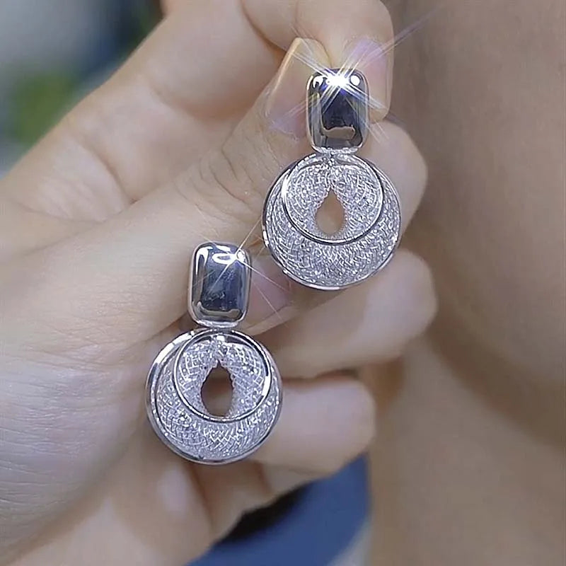 Shop Glam Sleek vintage round dangle earrings for women. Bold statement jewelry with an elegant design, perfect for parties, weddings and everyday style.