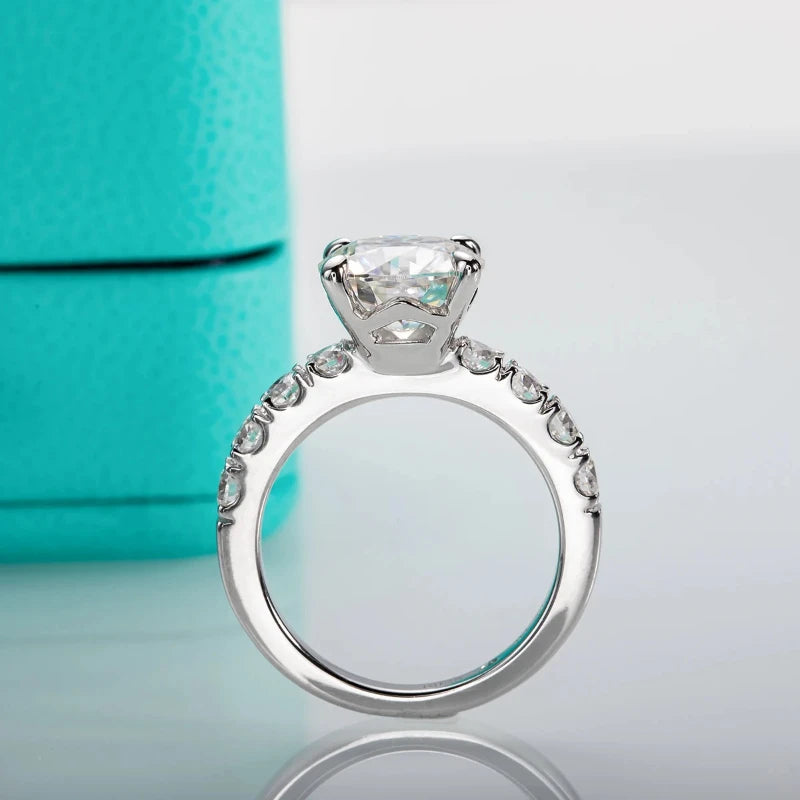 Introducing the **Sparkling Round Cut Moissanite Ring** by *Glam Sleek* – a timeless symbol of love and elegance. Featuring a brilliant round-cut moissanite gemstone, this ring sparkles with unmatched fire and clarity, perfect for promise, engagement, wedding, or anniversary celebrations. Expertly crafted with a sleek band, it combines modern sophistication with enduring charm, making it a radiant reminder of your everlasting commitment.