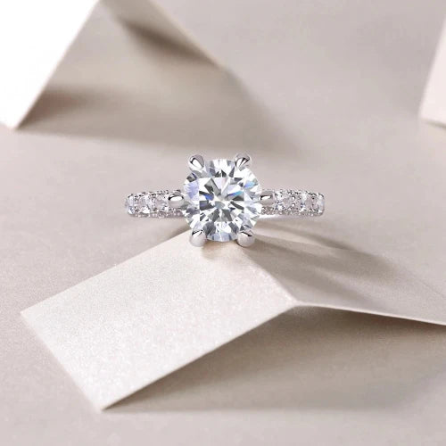 Introducing the **Glam Sleek Sparkling Round Cut Moissanite Ring**—an exquisite symbol of love and elegance. Featuring a brilliant 1-3ct real Moissanite stone, this stunning ring dazzles with unmatched fire and clarity. Perfect for promise, engagement, wedding, or anniversary, its timeless round-cut design ensures lasting beauty and sophistication. Celebrate your forever moments with the enduring brilliance of Moissanite, set in a sleek, luxurious band crafted for those who appreciate both style and sentime