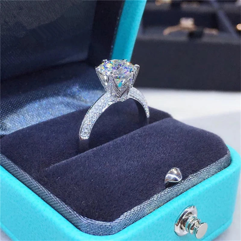 Introducing the **Sparkling Crown Moissanite Ring** by Glam Sleek – a stunning symbol of love and commitment. This elegant ring features a brilliant crown-set moissanite stone, known for its dazzling sparkle and lasting durability. Perfect for a promise, engagement, wedding, or anniversary, its timeless design ensures it shines in every moment. Crafted with precision and sophistication, this ring offers luxury without compromise, making it an unforgettable piece for any occasion.