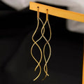Elevate your look with these minimalist long fringe earrings, designed with elegant wavy lines and a lightweight hanging style. Perfect for adding a modern, sophisticated touch to everyday outfits, parties, weddings, and special occasions. A versatile choice for women who love trendy statement earrings with a minimalist finish.