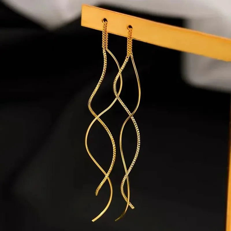 Elevate your look with these minimalist long fringe earrings, designed with elegant wavy lines and a lightweight hanging style. Perfect for adding a modern, sophisticated touch to everyday outfits, parties, weddings, and special occasions. A versatile choice for women who love trendy statement earrings with a minimalist finish.