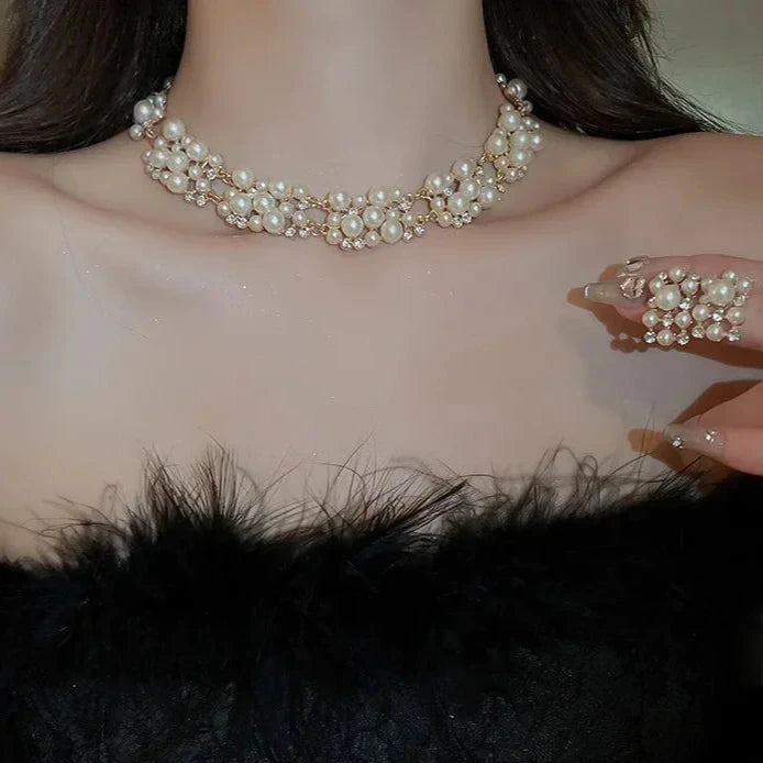 Elevate any look with Glam Sleek's Rhinestone Pearl Rectangular Earrings and Necklace Set. This chic set combines timeless pearls with shimmering rhinestones in a unique rectangular design, adding a touch of elegance to any outfit. Perfect for special occasions or adding a glam edge to everyday wear, it’s the ideal blend of classic beauty and modern style.