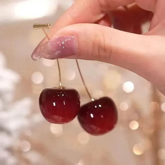 Red Cherry Drop Earrings by Glam Sleek – Add a pop of playful elegance to your look with these trendy red cherry drop earrings. Designed for modern fashion lovers, these lightweight statement earrings are perfect for parties, date nights, and everyday chic style. The bold cherry design brings a fun twist to your outfit, making them a must-have fashion accessory for women. Shop the latest stylish dangle earrings only at Glam Sleek.