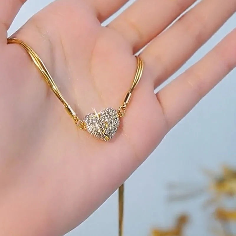 Celebrate your connection with the *Rhinestone Couple Magnetic Heart Pendant* from Glam Sleek. Designed with elegance and sentiment, this necklace set features two magnetic heart halves, symbolizing unity and love. Each pendant is adorned with sparkling rhinestones, bringing a touch of glamour to everyday wear. Perfect for couples, it’s a charming reminder of togetherness, beautifully crafted for those who cherish style and connection.