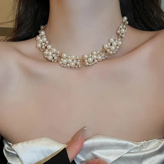 Elevate any look with Glam Sleek's Rhinestone Pearl Rectangular Earrings and Necklace Set. This chic set combines timeless pearls with shimmering rhinestones in a unique rectangular design, adding a touch of elegance to any outfit. Perfect for special occasions or adding a glam edge to everyday wear, it’s the ideal blend of classic beauty and modern style.