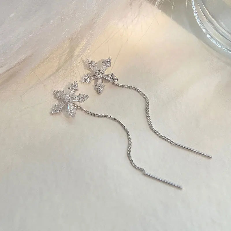 Introducing the New Needle Micro-Inlaid Zircon Flower Earrings by Glam Sleek—a perfect blend of elegance and sparkle. These dainty earrings feature meticulously crafted zircon petals, micro-inlaid for a brilliant, eye-catching shimmer. Lightweight and versatile, they add a touch of luxury to any outfit, day or night. Perfect for those who love a chic, timeless accessory.