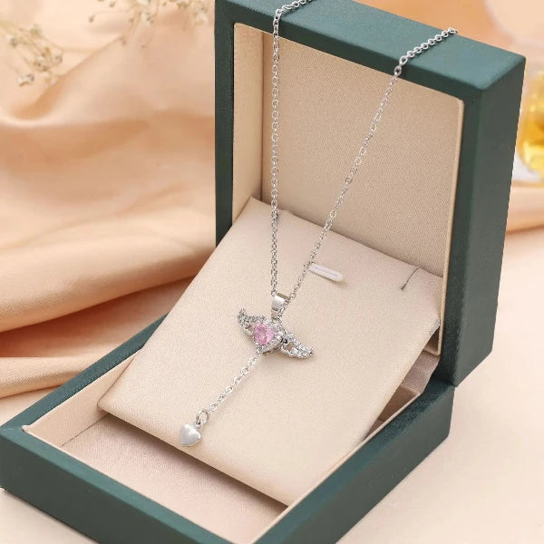 The New Cupid Angel's Wings Pendant by Glam Sleek is a delicate symbol of love and elegance. Featuring finely detailed angel wings, this pendant captures timeless grace and subtle charm, perfect for daily wear or special occasions. Crafted with high-quality materials and designed to shine with every movement, it’s a perfect gift to keep close to the heart.