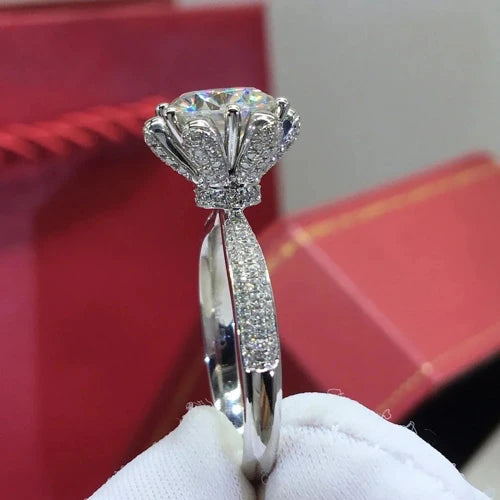 The *Sparkling Moissanite Flower Ring* by **Glam Sleek** is a stunning symbol of love and elegance. Featuring a radiant moissanite stone set in a delicate flower design, this ring captures light with breathtaking brilliance. Perfect for a promise, engagement, wedding, or anniversary, it combines timeless beauty with modern sophistication. Crafted with precision, it's a meaningful statement of forever.