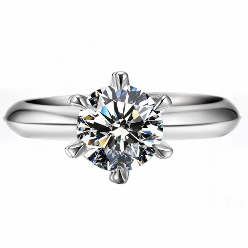 Introducing the **Glam Sleek Sparkling Sterling Silver Moissanite Ring**, a timeless piece designed for every special moment—be it a promise, engagement, wedding, or anniversary. Crafted in sterling silver, this ring features a dazzling moissanite stone that captures the brilliance of a diamond with unparalleled fire and durability. Elegant and versatile, it’s the perfect symbol of everlasting love.