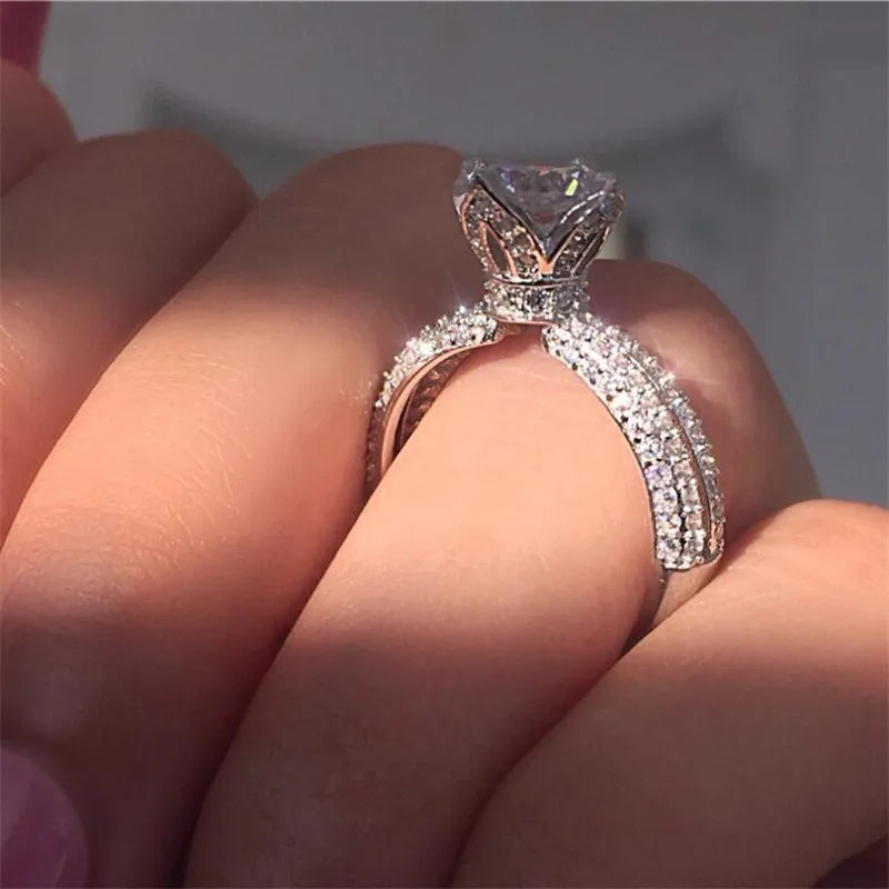 Introducing the *New Sparkling Crown* by Glam Sleek—a stunning symbol of love and commitment. Perfect for promises, engagements, anniversaries, or weddings, this ring features a dazzling crown-inspired design, meticulously crafted to capture elegance and brilliance. Its timeless sparkle embodies your most cherished moments, making it a breathtaking statement for any occasion.
