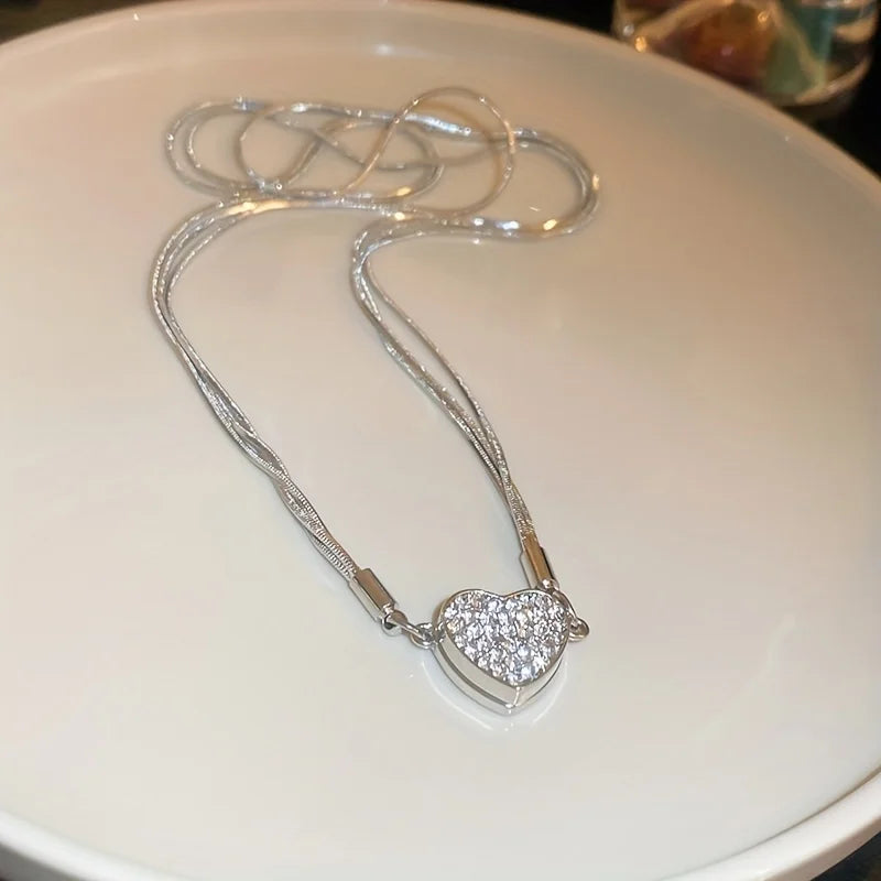 The *Elegant Heart Shaped Zircon Pendant* by Glam Sleek is the perfect blend of sophistication and charm. This exquisite pendant features a radiant zircon heart framed in a sleek, polished setting, capturing light beautifully to create a dazzling sparkle. Ideal for both everyday wear and special occasions, its timeless design complements any style, adding a touch of elegance and romance. A thoughtful gift choice that speaks to the heart, this pendant is crafted for those who appreciate refined simplicity an
